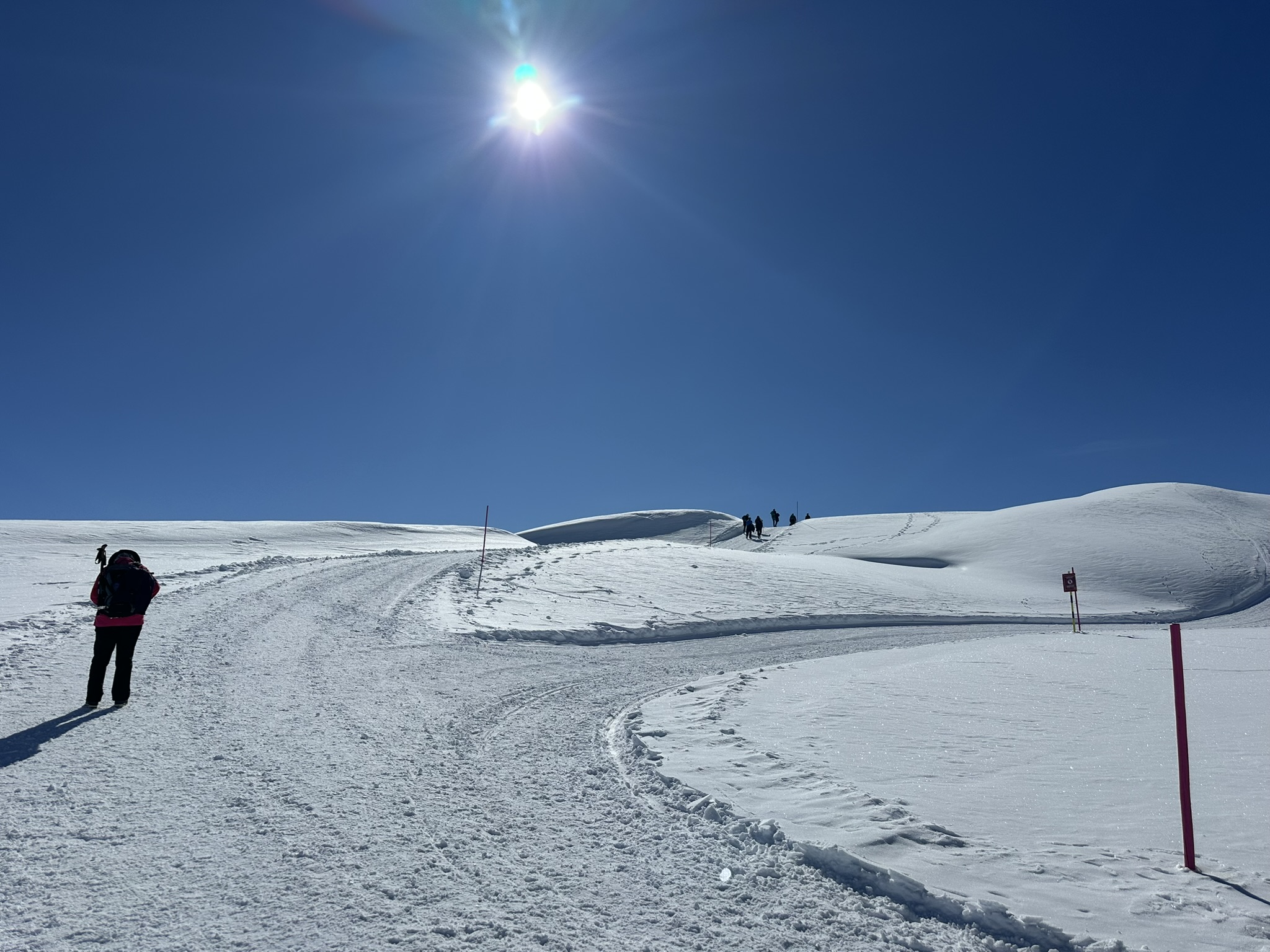 Winter hiking trail in bright sunshine