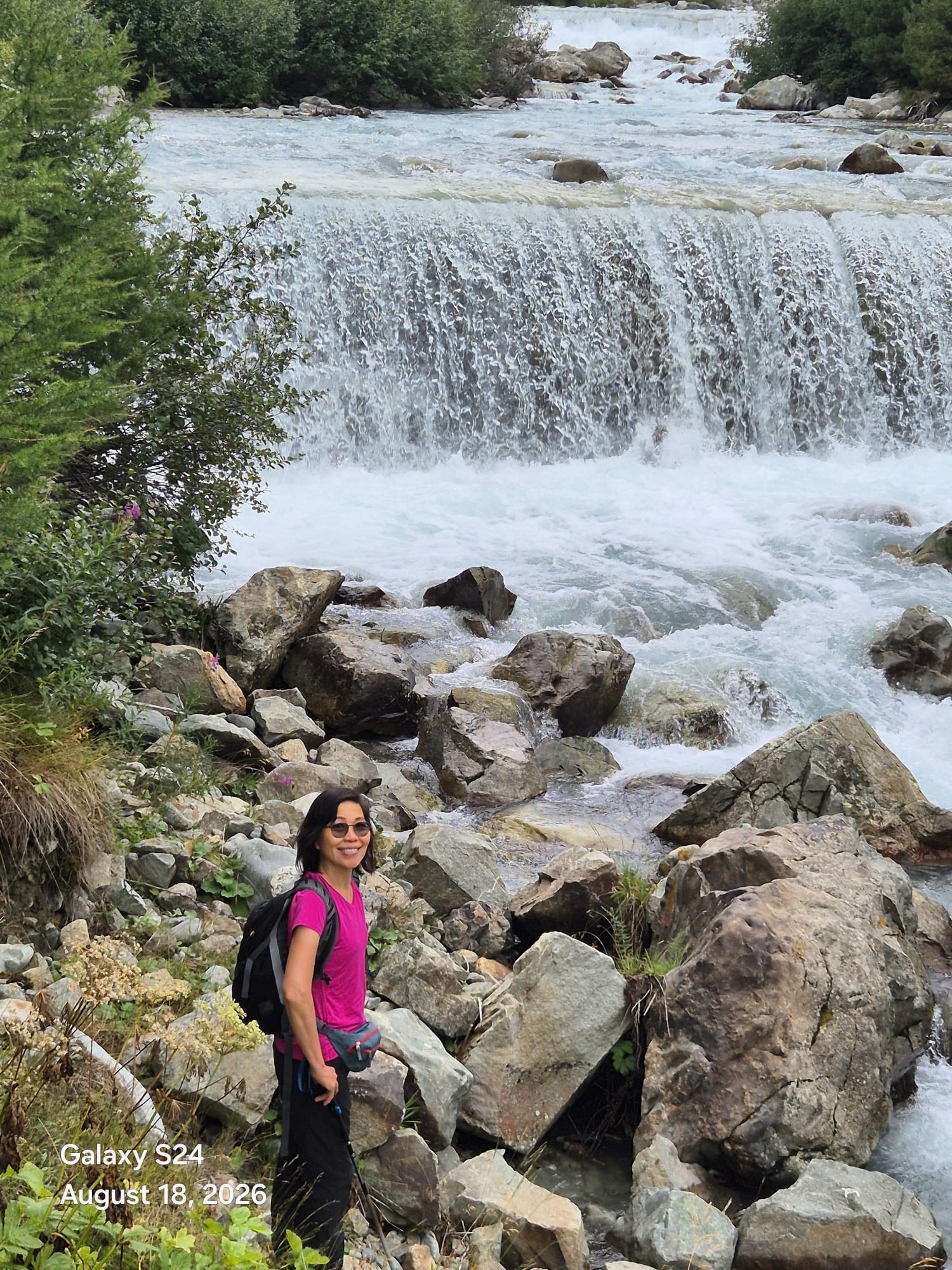 Glacier-fed waterfall and rushing river